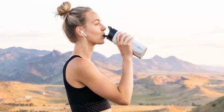 woman drinking redmond re-lyte
